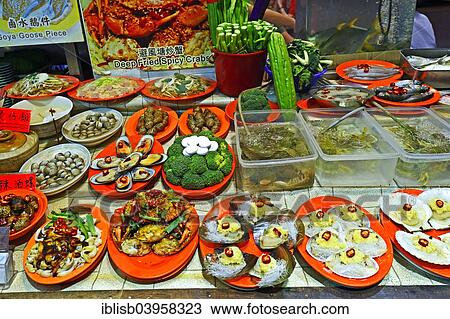 "Dishes of a seafood restaurant at the night market in Temple Street, Kowloon, Hong Kong, China, Asia" View Large Photo Image Stock Image - "Dishes of a seafood restaurant at the night market in Temple Street, Kowloon, Hong Kong, China, Asia". Fotosearch