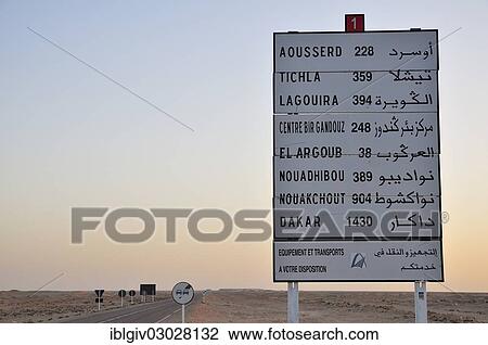Stock Image - "Distance information board towards Mauritania and Senegal, Dakar, Westsahara, bei Dakhla, Oued Ed-Dahab-Lagouira region, Morocco, Africa". Fotosearch