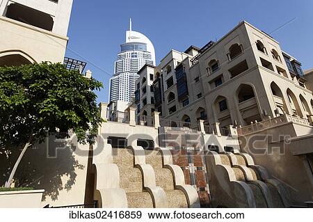 District built in the traditional style, Downtown Dubai, The Old Town, in front of a skyscraper, The Address, a luxury hotel, Dubai, United Arab Emirates, Middle East, Asia View Large Photo Image Stock Photo - District built in the traditional style, Downtown Dubai, The Old Town, in front of a skyscraper, The Address, a luxury hotel, Dubai, United Arab Emirates, Middle East, Asia. Fotosearch