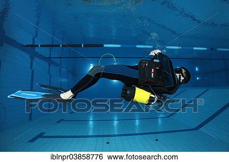 "Dive training, scuba diver facing the surface, balancing, in a swimming pool, Nuremberg, Bavaria, Germany, Europe" View Large Photo Image Stock Photograph - "Dive training, scuba diver facing the surface, balancing, in a swimming pool, Nuremberg, Bavaria, Germany, Europe". Fotosearch