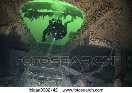 Stock Image - "Diver at the stairs leading to the lower deck of the shipwreck of the Austrian wheel steamship """"Durnstein"""", Odessa, Black Sea, Ukraine, Europe". Fotosearch