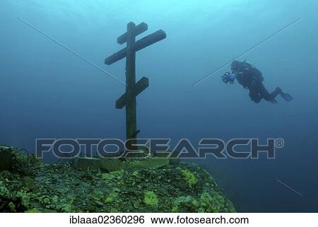 "Diver looking at a cross under water, consecrated and established on Feast of the Ascension 09. 06. 2005, Lake Baikal, Siberia, the Russian Federation, Eurasia. " View Large Photo Image Stock Photograph - "Diver looking at a cross under water, consecrated and established on Feast of the Ascension 09. 06. 2005, Lake Baikal, Siberia, the Russian Federation, Eurasia. ". Fotosearch