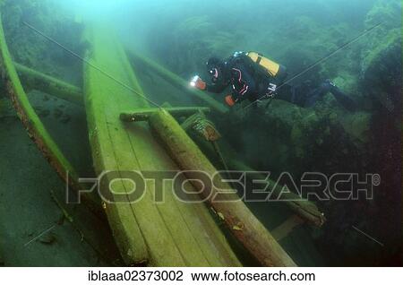 "Diver surveys the destroyed wooden mooring, lake Baikal, Siberia, Russia, Eurasia, Europe" View Large Photo Image Stock Image - "Diver surveys the destroyed wooden mooring, lake Baikal, Siberia, Russia, Eurasia, Europe". Fotosearch