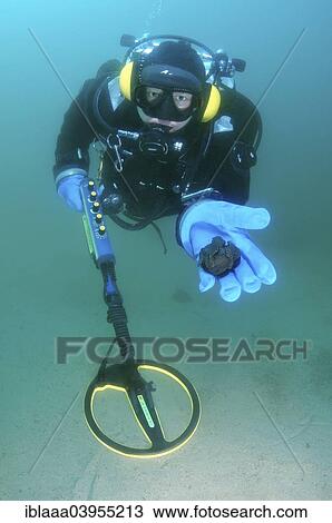 "Diver with metal detector displaying found ancient coins, Lake Baikal, Siberia, Russia, Europe" View Large Photo Image Stock Image - "Diver with metal detector displaying found ancient coins, Lake Baikal, Siberia, Russia, Europe". Fotosearch