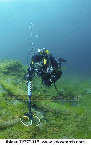 "Diver with the metal detector looks for a treasure under water, lake Baikal, Siberia, Russia, Eurasia, Europe" View Large Photo Image Stock Photograph - "Diver with the metal detector looks for a treasure under water, lake Baikal, Siberia, Russia, Eurasia, Europe". Fotosearch