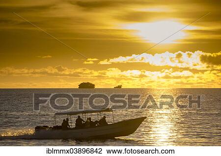 "Diving boats with tourists in the evening light, Palau, Micronesia, Oceania" View Large Photo Image Stock Image - "Diving boats with tourists in the evening light, Palau, Micronesia, Oceania". Fotosearch