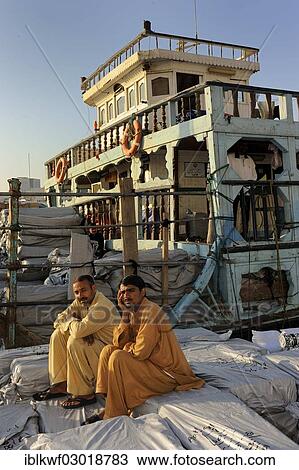 "Dockers sitting on sacks on a dhow, Daira, Dubai, Emirate of Dubai, United Arab Emirates, Asia" View Large Photo Image Stock Image - "Dockers sitting on sacks on a dhow, Daira, Dubai, Emirate of Dubai, United Arab Emirates, Asia". Fotosearch