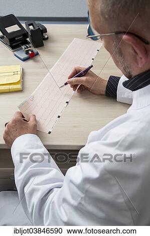"Doctor checking an ECG finding, Germany, Europe" View Large Photo Image Stock Image - "Doctor checking an ECG finding, Germany, Europe". Fotosearch