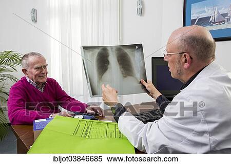 "Doctor's office, doctor talking to an elderly patient about the x-ray image of a lung, Germany, Europe" View Large Photo Image Stock Photography - "Doctor's office, doctor talking to an elderly patient about the x-ray image of a lung, Germany, Europe". Fotosearch