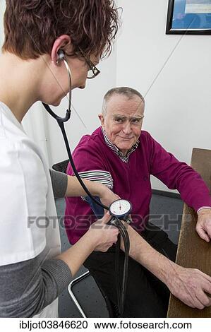 "Doctor's office, older patient gets his blood pressure taken by a doctor's assistant, Germany, Europe" View Large Photo Image Stock Image - "Doctor's office, older patient gets his blood pressure taken by a doctor's assistant, Germany, Europe". Fotosearch