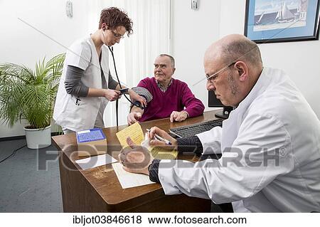 "Doctor's office, older patient gets his blood pressure taken by a doctor's assistant, Germany, Europe" View Large Photo Image Stock Photo - "Doctor's office, older patient gets his blood pressure taken by a doctor's assistant, Germany, Europe". Fotosearch