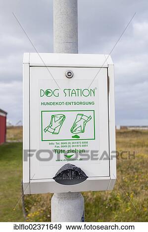 Stock Photo - "Dog Station, dispenser for dog waste bags, island of Heligoland, Schleswig-Holstein, Germany, Europe". Fotosearch