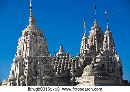 Stock Image - "Domes and Shikhara towers at a temple complex on the holy mountain Shatrunjaya, important pilgrimage site for followers of Jainism, one of the four most sacred mountains of Jainism, Palitana, Gujarat, India, Asia". Fotosearch