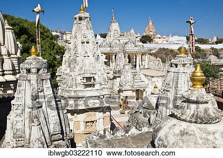 "Domes and Shikhara towers of the temple complex on the holy mountain of Shatrunjaya, pilgrimage site for followers of Jainism, one of the four most sacred mountains of Jainism, two pilgrims visiting the temple complex, Palitana, Gujarat, India, Asia" View Large Photo Image Stock Image - "Domes and Shikhara towers of the temple complex on the holy mountain of Shatrunjaya, pilgrimage site for followers of Jainism, one of the four most sacred mountains of Jainism, two pilgrims visiting the temple complex, Palitana, Gujarat, India, Asia". Fotosearch