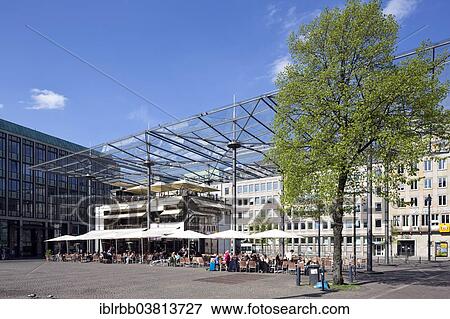 Stock Photo - "Domshof Forum, a glass roof over Domshof square, architect Joachim Schurmann, Cafe, Bremen, Germany, Europe". Fotosearch