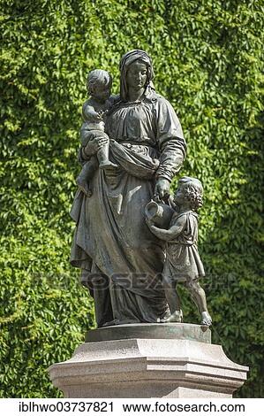 Stock Image - "Donndorfbrunnen, fountain figures of a mother with children, Weimar, Thuringia, Germany, Europe". Fotosearch