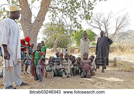 "Doro, 73, chief of the homestead, with his brothers, children and grandchildren, Bogdi, Garoua, North Region, Cameroon, Africa" View Large Photo Image Stock Image - "Doro, 73, chief of the homestead, with his brothers, children and grandchildren, Bogdi, Garoua, North Region, Cameroon, Africa". Fotosearch