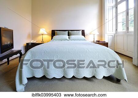 Double bed in a bedroom View Large Photo Image Stock Image - Double bed in a bedroom. Fotosearch