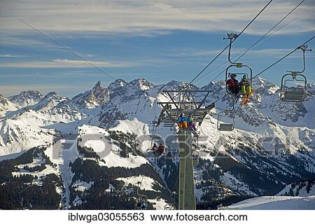 "Double chairlift, two person lift, Hahnenkoepflebahn to the mountain station, main ridge of the Allgaeu at back, Gottesackerplateau, Kleinwalsertal, Vorarlberg, Austria, Europe" View Large Photo Image Stock Image - "Double chairlift, two person lift, Hahnenkoepflebahn to the mountain station, main ridge of the Allgaeu at back, Gottesackerplateau, Kleinwalsertal, Vorarlberg, Austria, Europe". Fotosearch