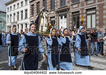 Stock Image - "Doudou City Festival, procession of 1, 500 people, some in original costumes, since 13th century, European Capital of Culture 2015, Mons, Wallonia, Belgium, Europe". Fotosearch