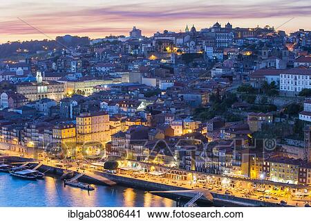 Stock Image - "Douro river and the historic centre of Ribeira at sunset, Porto, Unesco World Heritage Site, Portugal, Europe". Fotosearch
