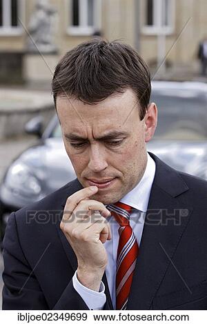 "Dr. Nils Schmid, member of the SPD, social-democratic party, Minister of Finance and Economy in Baden-Wuerttemberg, standing thoughtfully in front of a Porsche Panamera Hybrid, Stuttgart, Baden-Wuerttemberg, Germany, Europe" View Large Photo Image Stock Photo - "Dr. Nils Schmid, member of the SPD, social-democratic party, Minister of Finance and Economy in Baden-Wuerttemberg, standing thoughtfully in front of a Porsche Panamera Hybrid, Stuttgart, Baden-Wuerttemberg, Germany, Europe". Fotosearch