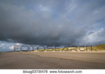 "Dramatic cloud formation over a North Sea beach, Henne Strand, Jutland, Denmark, Europe" View Large Photo Image Stock Photo - "Dramatic cloud formation over a North Sea beach, Henne Strand, Jutland, Denmark, Europe". Fotosearch