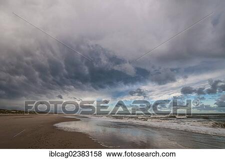 "Dramatic cloud formation over beach on the North Sea, Henne Beach, West Jutland, Denmark, Europe" View Large Photo Image Stock Photo - "Dramatic cloud formation over beach on the North Sea, Henne Beach, West Jutland, Denmark, Europe". Fotosearch