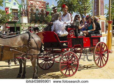 "Dressed up coachman and young ladies wearing gypsy dresses at the Feria del Caballo Horse Fair, Jerez de la Frontera, Cadiz province, Andalusia, Spain, Europe" View Large Photo Image Stock Image - "Dressed up coachman and young ladies wearing gypsy dresses at the Feria del Caballo Horse Fair, Jerez de la Frontera, Cadiz province, Andalusia, Spain, Europe". Fotosearch