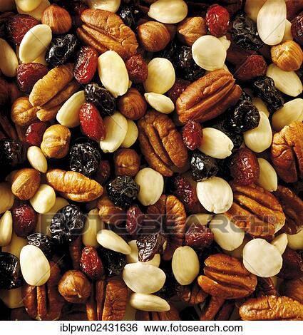 Stock Photograph - "Dried fruit and nut mix, pecans, almonds, raisins and dried cranberries". Fotosearch