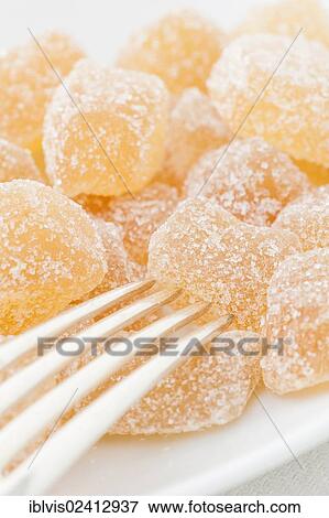 Dried ginger coated with sugar and a fork View Large Photo Image Stock Photo - Dried ginger coated with sugar and a fork. Fotosearch