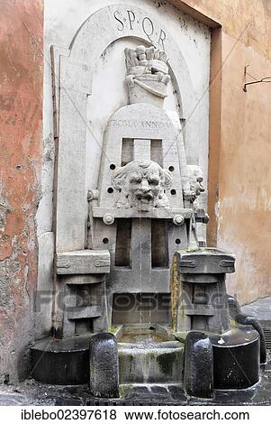 Stock Photo - "Drinking water fountain, lettering SPQR, restored in 1998 by Stefano Gasbarri, Via Margutta, Rome, Italy, Europe". Fotosearch