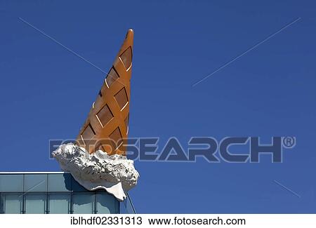 "Dropped Cone"""" by the pop-art artist Claes Oldenburg, ice cone sculpture on the roof of the Neumarkt Galerie, Cologne, North Rhine-Westphalia, Germany, Europe" View Large Photo Image Stock Image - "Dropped Cone"""" by the pop-art artist Claes Oldenburg, ice cone sculpture on the roof of the Neumarkt Galerie, Cologne, North Rhine-Westphalia, Germany, Europe". Fotosearch