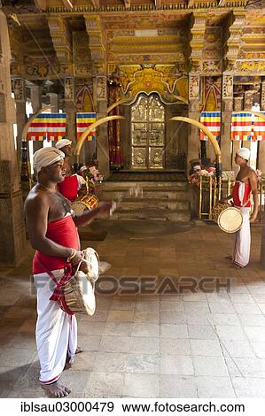 "Drummers standing in front of golden gate, Buddhist shrine, Sri Dalada Maligawa, Temple of the Tooth in Kandy, Kandy, Sri Lanka, Asia" View Large Photo Image Stock Photo - "Drummers standing in front of golden gate, Buddhist shrine, Sri Dalada Maligawa, Temple of the Tooth in Kandy, Kandy, Sri Lanka, Asia". Fotosearch