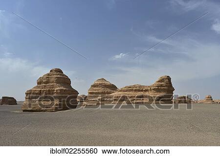 "Dry desert landscape with rock formations, historic Silk Road, Yumen Pass, Yadan National Park, Gansu, China, Asia" View Large Photo Image Stock Image - "Dry desert landscape with rock formations, historic Silk Road, Yumen Pass, Yadan National Park, Gansu, China, Asia". Fotosearch