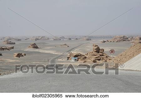Stock Photography - "Dry desert landscape with rock formations, historic Silk Road, Yumen Pass, Yadan National Park, Gansu, China, Asia". Fotosearch