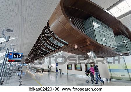 Dubai International Airport, family on the way to the gate, United Arab Emirates, Middle East, Asia View Large Photo Image Stock Photo - Dubai International Airport, family on the way to the gate, United Arab Emirates, Middle East, Asia. Fotosearch