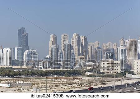 Dubai skyline with a marina and barren land, Dubai, United Arab Emirates, Middle East, Asia View Large Photo Image Stock Photo - Dubai skyline with a marina and barren land, Dubai, United Arab Emirates, Middle East, Asia. Fotosearch
