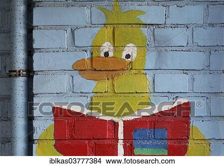"Duck figure reading a book, mural in a school playground, Germany, Europe" View Large Photo Image Picture - "Duck figure reading a book, mural in a school playground, Germany, Europe". Fotosearch