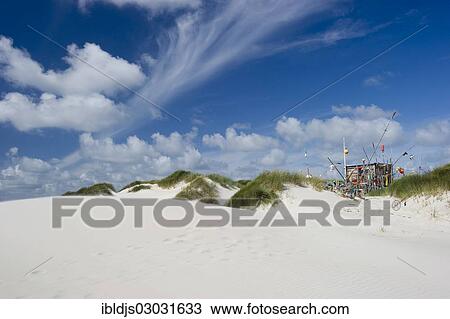 "Dunes, white sandy beach and a hut made of flotsam, Kniepsand, Amrum, Amrum, North Frisian Islands, Schleswig-Holstein, Germany, Europe" View Large Photo Image Stock Image - "Dunes, white sandy beach and a hut made of flotsam, Kniepsand, Amrum, Amrum, North Frisian Islands, Schleswig-Holstein, Germany, Europe". Fotosearch