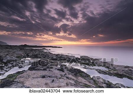 "Dusk over Watchet Beach, with rockpools in the foreground, England, United Kingdom, Europe" View Large Photo Image Picture - "Dusk over Watchet Beach, with rockpools in the foreground, England, United Kingdom, Europe". Fotosearch