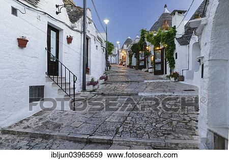 "Dusk, shop, trulli traditional round houses, Rione Monti, Alberobello, Valle d'Itria, Trulli Valley, Apulia, Italy, Europe" View Large Photo Image Stock Photo - "Dusk, shop, trulli traditional round houses, Rione Monti, Alberobello, Valle d'Itria, Trulli Valley, Apulia, Italy, Europe". Fotosearch