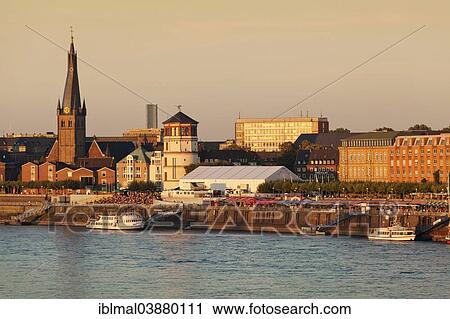 "Dusseldorf's historic town centre with St. Lambertus Church and Schlossturm tower on the Rhine promenade, Dusseldorf, North Rhine-Westphalia, Germany, Europe" View Large Photo Image Stock Image - "Dusseldorf's historic town centre with St. Lambertus Church and Schlossturm tower on the Rhine promenade, Dusseldorf, North Rhine-Westphalia, Germany, Europe". Fotosearch