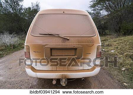 Picture - "Dusty car on on a gravel road, Baviaanskloof Nature Reserve, Eastern Cape, South Africa, Africa". Fotosearch