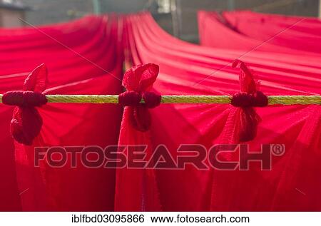 Stock Photograph - "Dyed red material drying outside, Kathmandu Valley, Kathmandu, Kathmandu District, Bagmati Zone, Nepal, Asia". Fotosearch