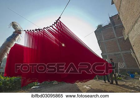 "Dyed red material drying outside, Kathmandu Valley, Kathmandu, Kathmandu District, Bagmati Zone, Nepal, Asia" View Large Photo Image Stock Photography - "Dyed red material drying outside, Kathmandu Valley, Kathmandu, Kathmandu District, Bagmati Zone, Nepal, Asia". Fotosearch