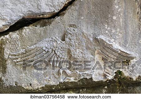 Stock Photo - "Eagle relief on the grave of Alcetas, ancient city of Termessos, Taurus Mountains, Termessos, Antalya Province, Turkey, Asia". Fotosearch