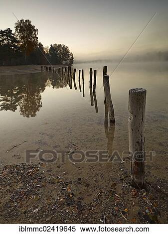 Early morning mood at Kuhsee lake with a bathing bay, Augsburg, Swabia, Bavaria, Germany, Europe View Large Photo Image Stock Photography - Early morning mood at Kuhsee lake with a bathing bay, Augsburg, Swabia, Bavaria, Germany, Europe. Fotosearch
