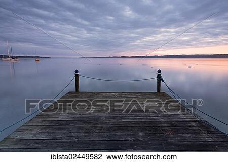 Stock Image - "Early morning mood in autumn on Lake Starnberg, Bavaria, Germany, Europe, PublicGround, Europe". Fotosearch
