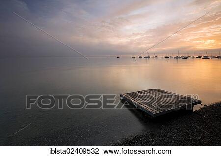 Stock Image - "Early morning on Lake Constance, Switzerland, Europe". Fotosearch